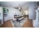 Open-concept dining area featuring wood floors, fireplace, and modern furnishings at 229 Lindy Creek Rd, Goose Creek, SC 29445