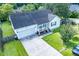 Charming single-story home with an attached garage and a cozy front porch, surrounded by lush greenery at 229 Lindy Creek Rd, Goose Creek, SC 29445