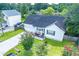 Charming single-story home with a welcoming front porch and a convenient attached garage, surrounded by lush greenery at 229 Lindy Creek Rd, Goose Creek, SC 29445