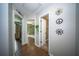 Inviting hallway with decorative wall art and views into well-lit rooms of the home at 229 Lindy Creek Rd, Goose Creek, SC 29445