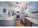 Updated kitchen with stainless steel appliances, granite countertops, and a functional center island at 229 Lindy Creek Rd, Goose Creek, SC 29445
