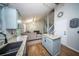 Open-concept kitchen and living area with granite countertops and stainless steel appliances at 229 Lindy Creek Rd, Goose Creek, SC 29445