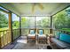 Charming screened porch with comfortable lounge furniture and an inviting atmosphere at 229 Lindy Creek Rd, Goose Creek, SC 29445