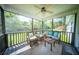 Cozy screened-in porch with comfortable furniture, perfect for enjoying the outdoors at 229 Lindy Creek Rd, Goose Creek, SC 29445