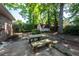 Backyard view showing a storage shed and concrete patio with benches at 2320 Wofford Rd, Charleston, SC 29414
