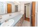 A neutral-toned bathroom features a large vanity and a sink with brass fixtures at 2320 Wofford Rd, Charleston, SC 29414