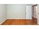 A bedroom with hardwood floors features white trim and light-colored walls at 2320 Wofford Rd, Charleston, SC 29414