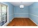 Open-concept dining area boasts hardwood floors and a modern light fixture at 2320 Wofford Rd, Charleston, SC 29414