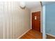 Front entry showcases a hardwood floor, patterned wallpaper, and a solid wood door at 2320 Wofford Rd, Charleston, SC 29414