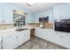 Bright kitchen features white cabinets, countertops, and appliances at 2320 Wofford Rd, Charleston, SC 29414