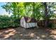 Exterior shot of a shed with red trim in a shady backyard at 2320 Wofford Rd, Charleston, SC 29414