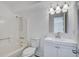 Bright bathroom with a shower/tub combo, white vanity, mirror, and chrome fixtures at 2334 Treescape Dr # 2006, Charleston, SC 29414
