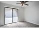 Bright bedroom featuring a ceiling fan, carpeted floors, and sliding glass doors at 2334 Treescape Dr # 2006, Charleston, SC 29414