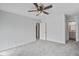 Light-filled bedroom featuring a ceiling fan, neutral carpet, and ensuite bathroom access at 2334 Treescape Dr # 2006, Charleston, SC 29414