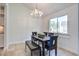 Charming dining area featuring a stylish chandelier, table with seating, and natural light through the window view at 2334 Treescape Dr # 2006, Charleston, SC 29414