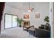 A cozy living room featuring a fireplace, comfortable seating, and stylish decor with modern ceiling fan and paint at 2334 Treescape Dr # 2006, Charleston, SC 29414