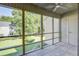 Screened porch features tiled floors and a view of the backyard and neighborhood at 2334 Treescape Dr # 2006, Charleston, SC 29414