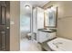 Bathroom featuring a built-in vanity, mirror, and walk-in toilet at 250 W Medina St, Summerville, SC 29483