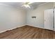 Bedroom featuring wood-look flooring, neutral walls, and trim at 250 W Medina St, Summerville, SC 29483