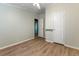 Bedroom with wood-look flooring, open doorway, and ample space at 250 W Medina St, Summerville, SC 29483