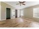 Spacious bedroom features hardwood floors, two windows, ceiling fan, and walk-in closets at 250 W Medina St, Summerville, SC 29483