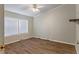 Bedroom featuring wood-look flooring, window, and neutral colored trim at 250 W Medina St, Summerville, SC 29483