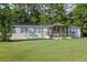 Charming single-story home with a covered front porch and well-kept lawn at 250 W Medina St, Summerville, SC 29483