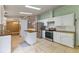 Well-equipped kitchen with stainless steel appliances, white cabinets, and tile flooring at 250 W Medina St, Summerville, SC 29483