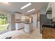 Bright kitchen featuring white cabinets, an island, and stainless steel appliances at 250 W Medina St, Summerville, SC 29483