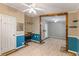 Open living area with wood-look flooring, custom trim, and a built-in desk at 250 W Medina St, Summerville, SC 29483