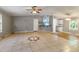 Open-concept living room with tile flooring and ample natural light at 250 W Medina St, Summerville, SC 29483
