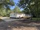A well-maintained backyard showcasing the home's exterior and a spacious deck at 260 Lake Dr, Summerville, SC 29483