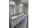 Bright bathroom features a double sink vanity, a window, and modern fixtures at 260 Lake Dr, Summerville, SC 29483