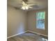 Neutral bedroom has wood-look floors and a window to let in natural light at 260 Lake Dr, Summerville, SC 29483