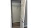 White closet has ample metal shelving and wood-look floors at 260 Lake Dr, Summerville, SC 29483