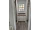 Bright walk-in closet features built-in drawers and a view to the exterior at 260 Lake Dr, Summerville, SC 29483