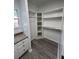 Spacious walk-in closet features built-in corner shelving and a clothes rod at 260 Lake Dr, Summerville, SC 29483