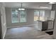 Dining area filled with natural light boasting wood-look flooring, neutral paint, and stainless steel appliances at 260 Lake Dr, Summerville, SC 29483