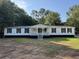 Inviting single story home with a covered front porch and classic shutters at 260 Lake Dr, Summerville, SC 29483