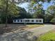 Charming single story home with a welcoming front porch and well maintained landscape at 260 Lake Dr, Summerville, SC 29483