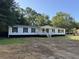 Inviting single story home with a covered front porch and classic shutters at 260 Lake Dr, Summerville, SC 29483