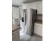 A spacious kitchen with stainless steel refrigerator and ample cabinet space at 260 Lake Dr, Summerville, SC 29483