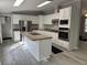 Bright kitchen featuring stainless steel appliances, white cabinets, and wood-look flooring at 260 Lake Dr, Summerville, SC 29483