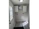 Functional laundry room with white cabinets, wood-look flooring and access to exterior at 260 Lake Dr, Summerville, SC 29483