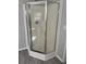 Enclosed shower features a corner seat and updated fixtures at 260 Lake Dr, Summerville, SC 29483