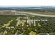Aerial view of the property's location in relation to the Stono River, Folly Beach, and surrounding community at 2640 Battle Trail Dr, Johns Island, SC 29455