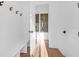 Bright hallway with white shiplap walls, light wood floors, and a built-in bench at 2640 Battle Trail Dr, Johns Island, SC 29455