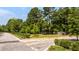 The landscaped street and fenced lot features a paved driveway at 2640 Battle Trail Dr, Johns Island, SC 29455
