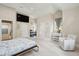 This bedroom features a TV, desk, sitting area, and vaulted ceilings at 2645 Gnarled Pine, Seabrook Island, SC 29455