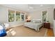 Comfortable bedroom with natural light, ceiling fan and hardwood floors at 2645 Gnarled Pine, Seabrook Island, SC 29455